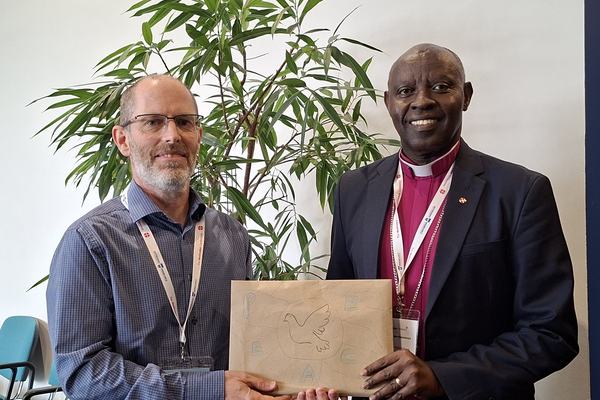 Bishop Samuel receiving messages of peace to take home