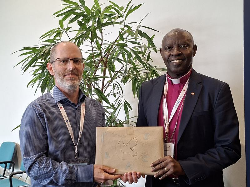 Bishop Samuel receiving messages of peace to take home