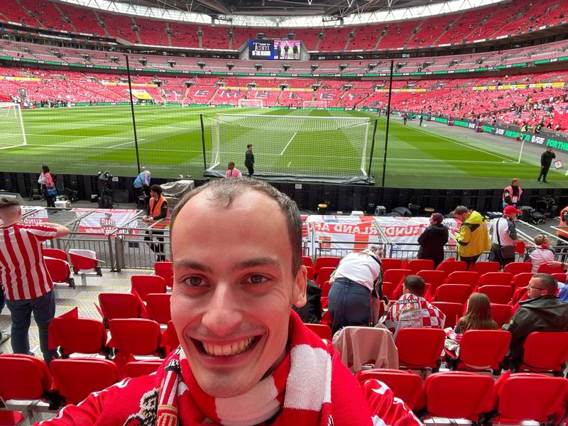 A young man at a football match in the stadium