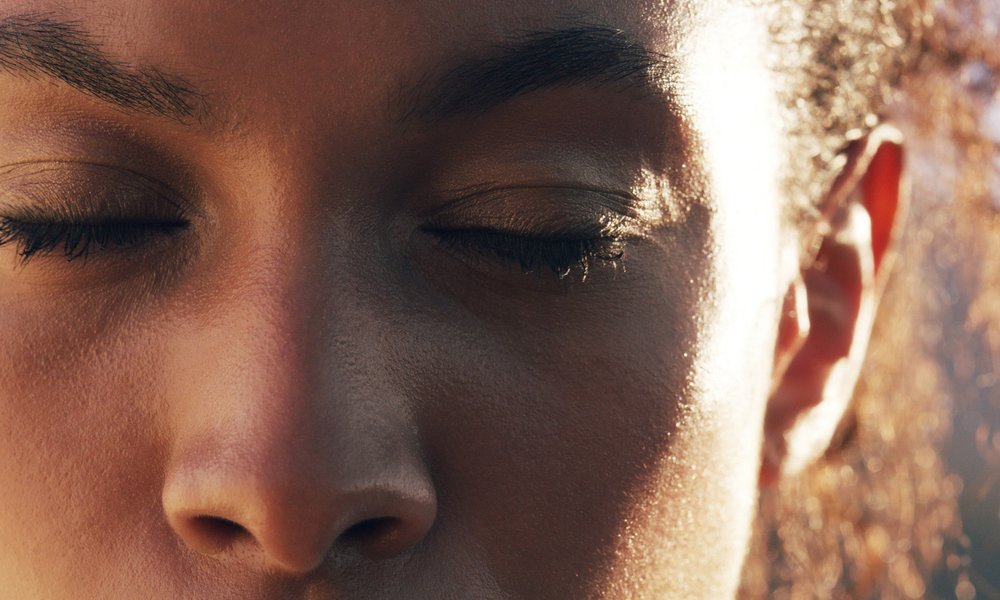 A close up of a young woman's face
