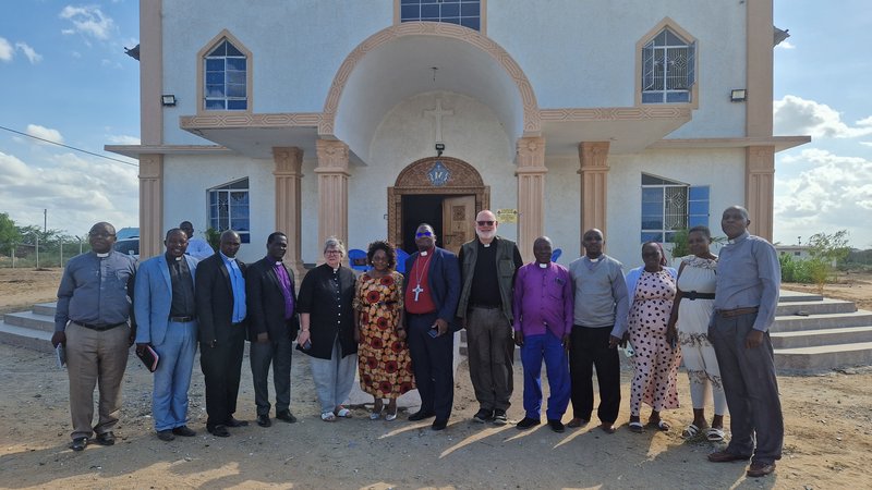 stands outside historic church