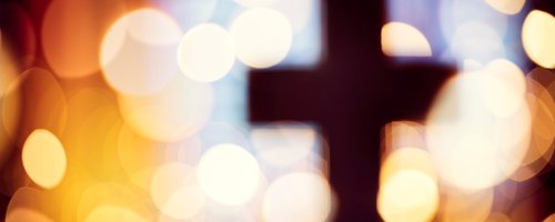 Blurred out cross with lights