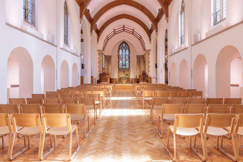 An image showing the interior after the works with chairs replacing pews