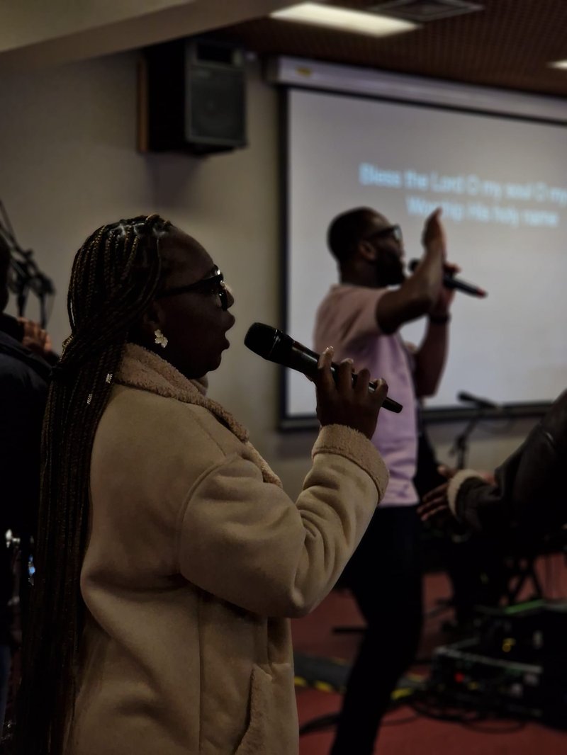 A lady sings at the Wholehearted Conference