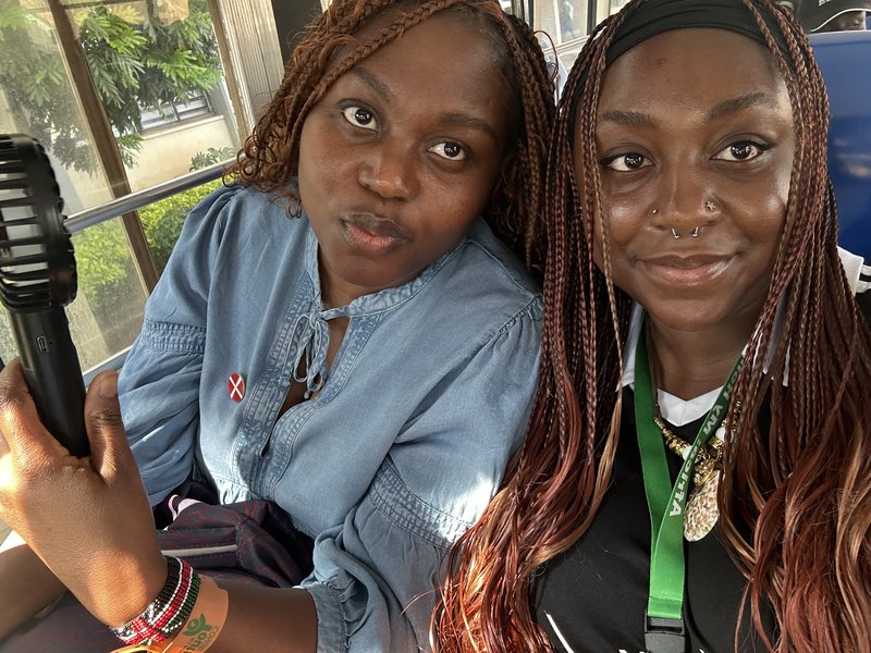 Selfie of two women sat on bus