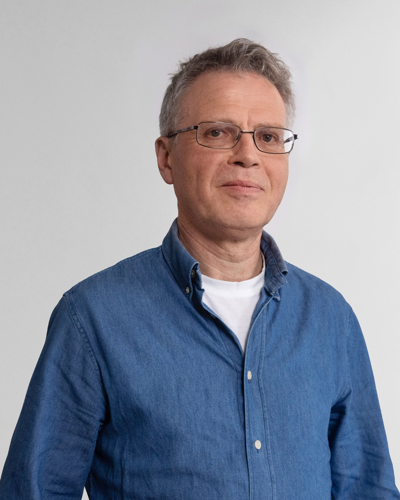 Headshot of Julian Bond in a blue shirt