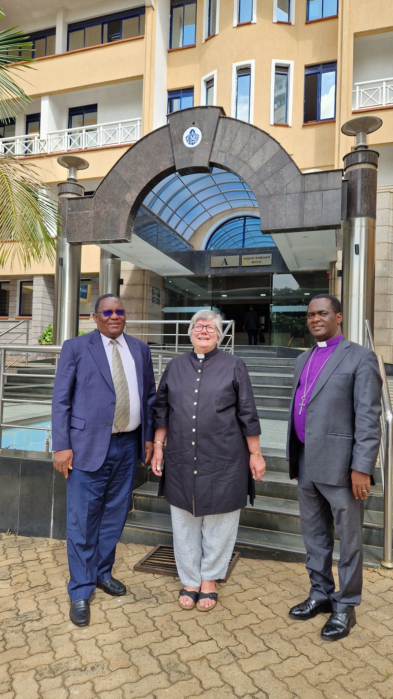 MCB President Helen Cameron stands with Presiding Bishop Isaiah Deye and Secretary of Conference, Bishop John Maromba of Kenya