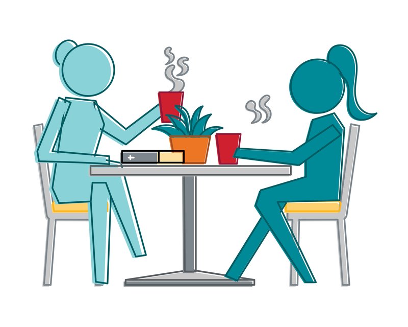 Two people chatting in a cafe