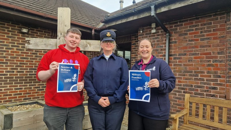 The Methodist Youth President in a 3Generate hoody, an RAF Chaplain and a member of the Girls' Brigade holding resources supporting military families