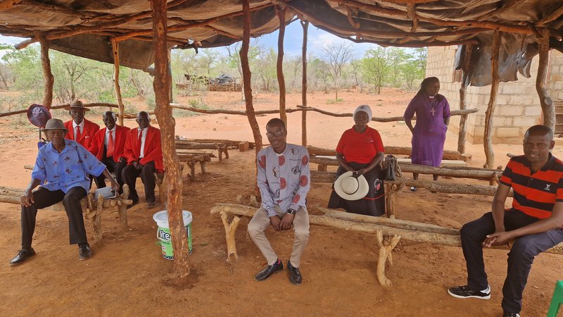 benches with church members sat on them