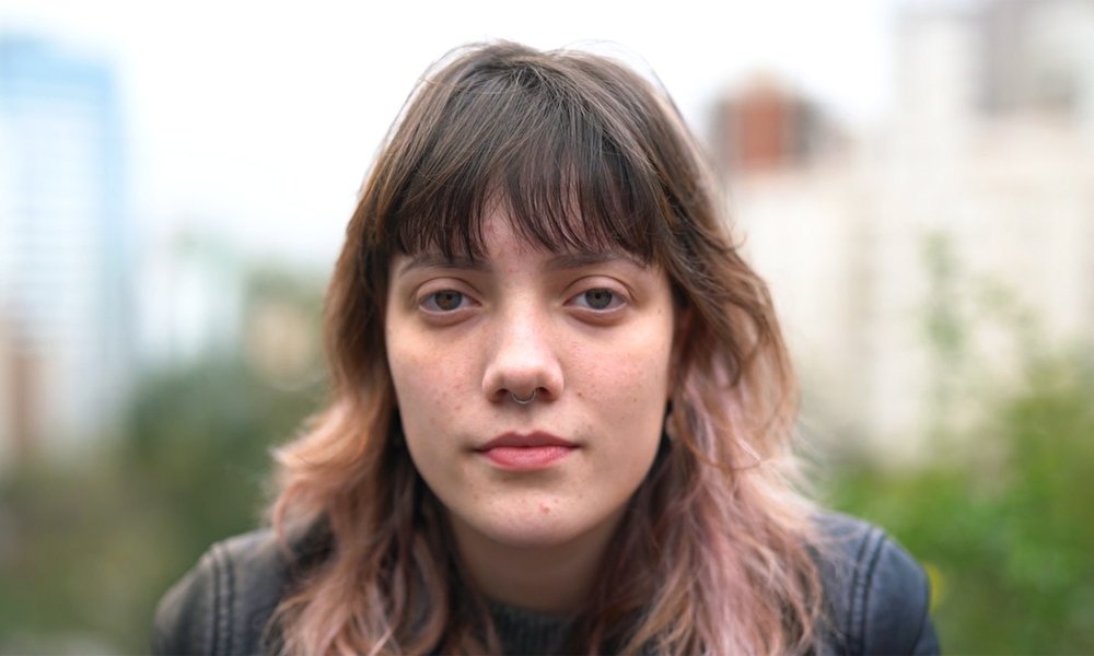 Young woman looks at the camera