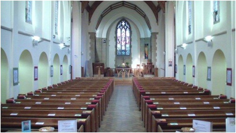 The interior of High Street Harpenden Methodist Church showing pews