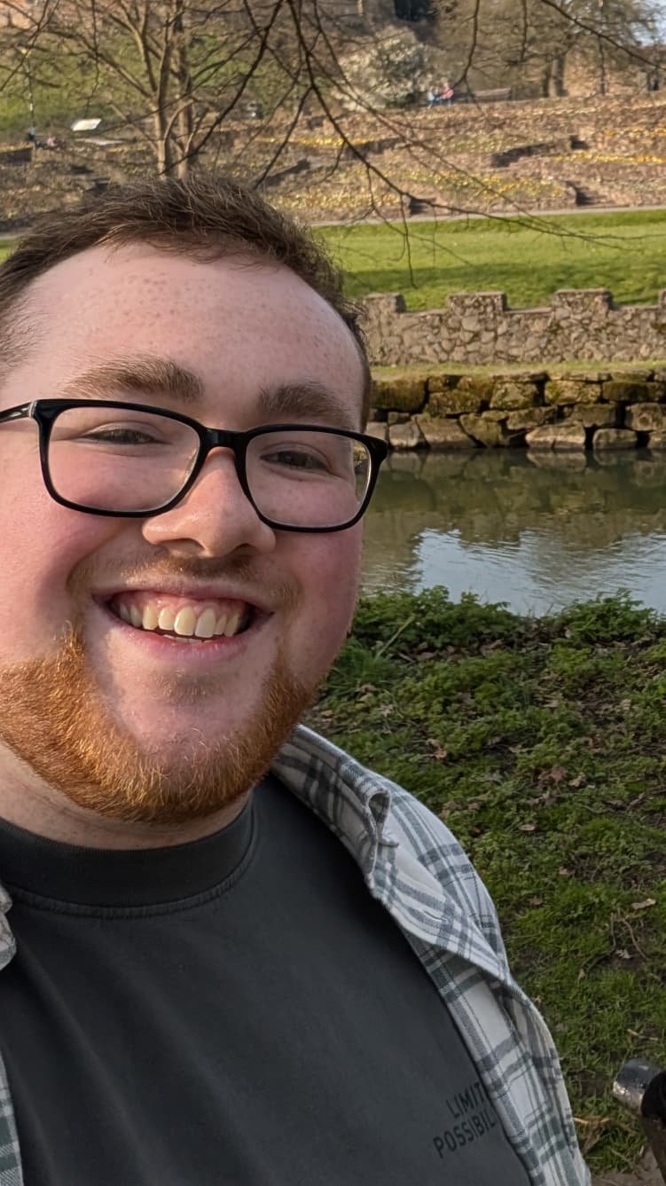 Face shot of Own, a young man with a beard
