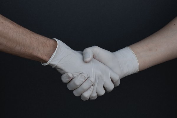 people-shaking-hands-in-latex-gloves-3959482